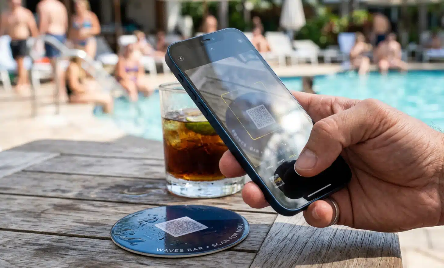 Guest struggling to scan a small low contrast QR code on a glossy coaster in bright sunlight