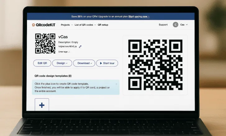 Laptop displaying the QRcodeKIT dashboard with design template options and dynamic QR code settings.